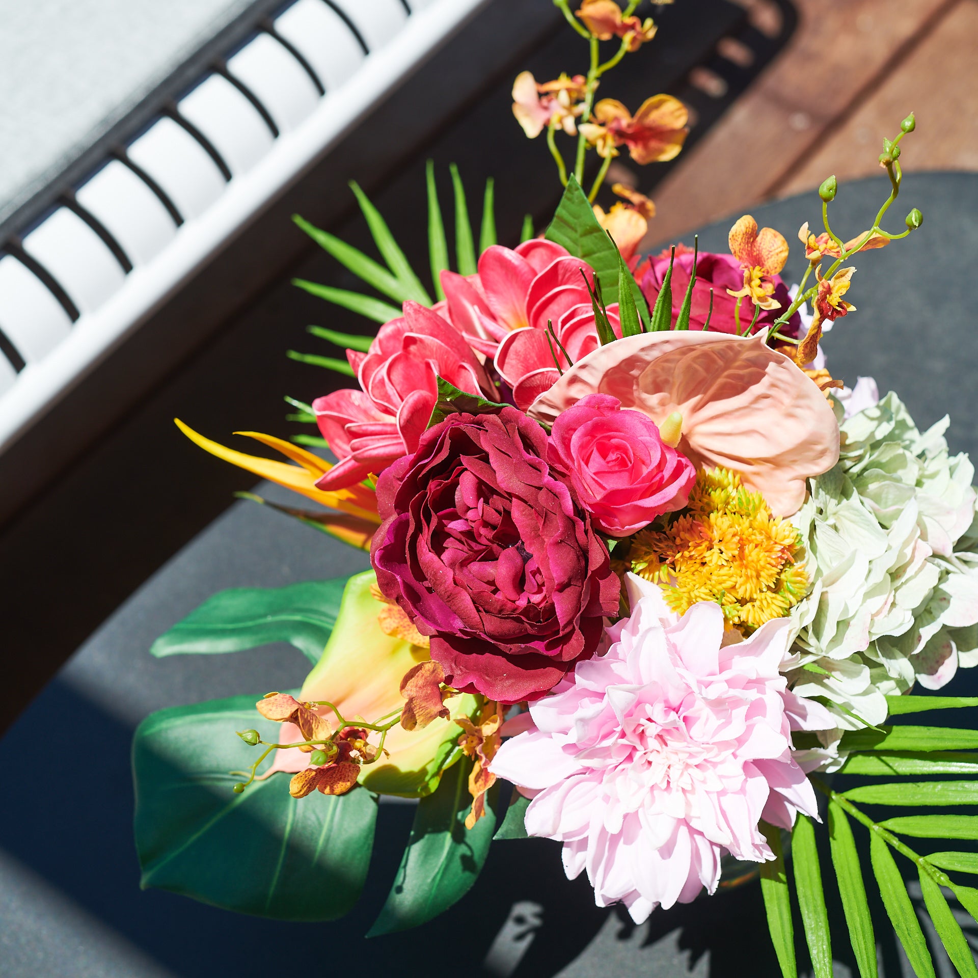 monstera and ginger with red dahlias arrangement Frida